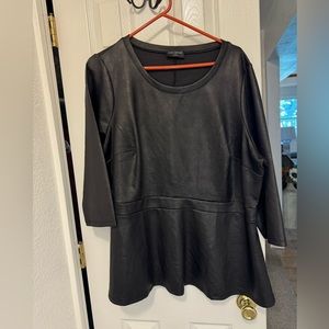 Faux leather a-line top with 3/4 length sleeves.